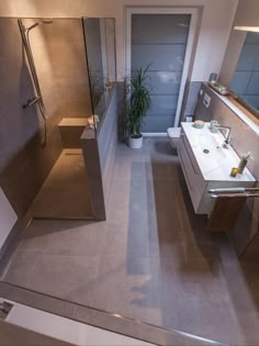 an aerial view of a bathroom with a sink, toilet and bathtub in it