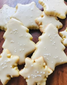 several decorated cookies sitting on top of a wooden table