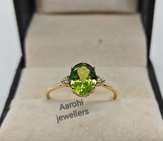 Band : Aarohi Jewellers Material : 14k Yellow Gold Gemstone : 100% Natural Peridot Peridot Stone Weight : 2.50 Ct Peridot Stone Size: 9x7 mm Style: Minimalist  All of our jewelry is handmade with great care by our team.  Thank you for visiting our store.  https://www.etsy.com/your/shops/Aarohijewellers/tools/listings/create Green Cocktail Ring, Dimond Ring, Peridot Engagement Rings, Green Cocktail, Kids Rings, Peridot Stone, Ring Birthstone, Peridot Ring, Green Peridot