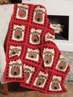 a crocheted bear afghan is shown in front of a fireplace