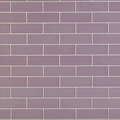 a purple brick wall is shown in this image