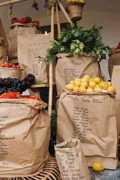 several bags filled with fruits and vegetables on top of a table