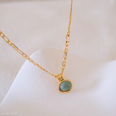 Elevate your style with our dainty jade necklace, featuring a striking green jade pendant on a chunky gold chain. This elegant piece seamlessly blends the natural beauty of green jade with the bold sophistication of a chunky gold chain, making it perfect for adding a touch of luxury to any outfit. Ideal as a gift for her, this natural green stone jewelry is versatile enough for both casual and formal occasions. Discover the timeless charm of this unique necklace, designed to enhance any look wit Gold Jade Round Pendant Necklace, Gold Jade Necklace With Round Pendant, Jade Clavicle Chain Necklace, Gold Jade Pendant Necklace, Green Necklaces With Gold Chain For Gifts, Green Necklace With Gold Chain Gift, Green Round Chain Necklace, Green Pendant Chain Necklace With Delicate Chain, Green Gold Plated Necklace With Adjustable Chain