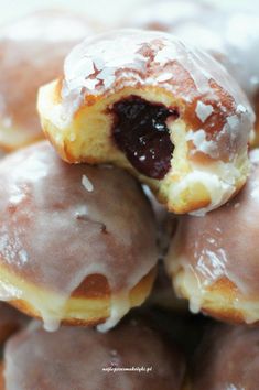 a pile of doughnuts sitting on top of each other covered in icing