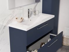 a bathroom vanity with two drawers and a sink in the middle, next to a mirror