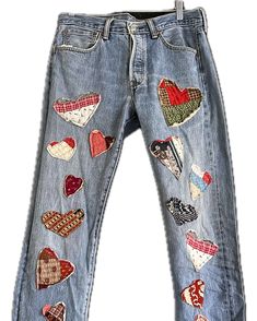 a pair of jeans with hearts on them