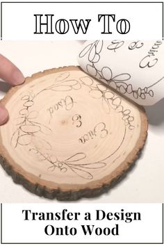 someone is drawing on a wood slice with the words, how to transfer a design onto wood