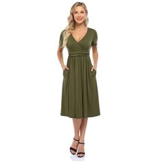 This dress features a V-neck design for a stylish and flattering look. Chic V-neck Solid Color Midi Dress, Chic Green V-neck Dress With Surplice Neckline, Flattering V-neck Spring Dresses, Flattering V-neck Wrap Dress For Summer, Solid Color V-neck Midi Dress For Work, Knee-length Solid Color V-neck Dress For Work, Chic Solid Color Midi V-neck Dress, Chic Midi-length V-neck Dress In Solid Color, Fitted V-neck Flattering Maxi Dress