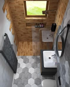 an aerial view of a small bathroom with wood paneling and tile flooring, along with a white toilet and sink