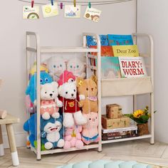 there are many stuffed animals on the shelf in this child's playroom area