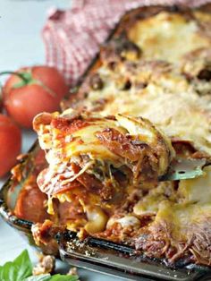 the lasagna casserole is loaded with meat, cheese and sauces