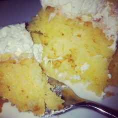 a close up of a piece of cake on a plate with a fork in it