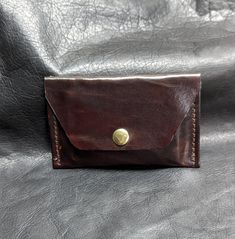 This, hand dyed, card wallet is only 4.75 W x 2.75 H yet easily holds 10+ credit cards.  Choose how this minimalist wallet/card holder suits your needs and then put it to work.  Choose your look from a simple snap closure or the more elegant strap closure.  Either way your cards are secure. Black Minimalist Card Holder With Coin Pocket, Minimalist Black Wallet With Coin Pocket, Minimalist Leather Card Holder, Modern Leather Card Holder With Coin Pocket, Minimalist Card Wallet, Luxury Leather Compact Card Holder, Minimalist Cards, Minimalist Wallet, Money Clip