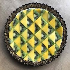 there is a pie with kiwi slices on it