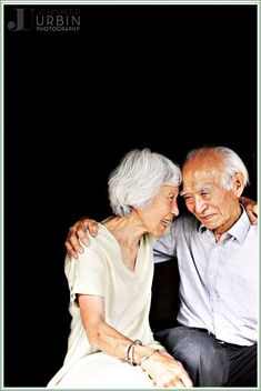 an older man and woman sitting next to each other on a black background with the caption jumboin