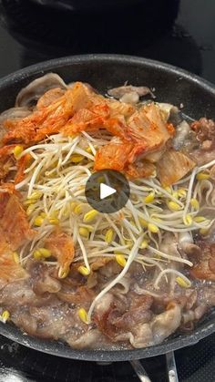 the food is being cooked in the skillet on the stove with utensils