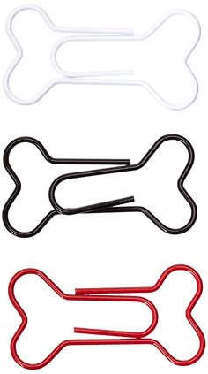 three dog bone shaped paper clips in various colors and sizes, with one red clip on each side