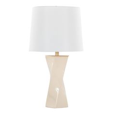 a table lamp with a white shade on it