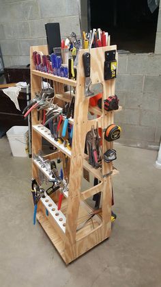 a wooden shelf filled with lots of tools