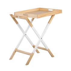 a wooden table with two white legs and a tray on it's side, against a white background