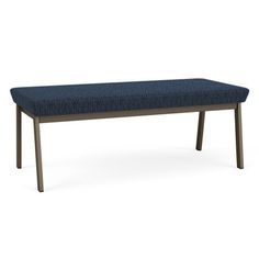 an upholstered bench with dark blue fabric