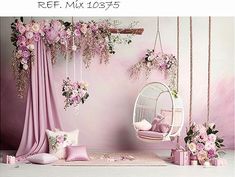 a room with pink flowers and hanging chairs