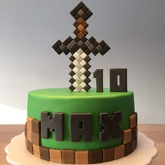 a cake decorated with the word minecraft on it