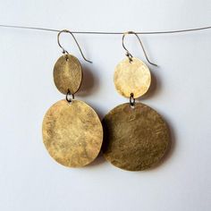 Textured discs are fun and lightweight to wear and have movement too.• Red brass hand forged discs.• Materials: brass, sterling silver.• Packaged in a jewelry box.• Add gift wrapping at checkout for hand tied satin bow. Artist designed, forged from brass, and built for a lifetime.Female owned, operated and made in the heart of Seattle. Disk Earrings, Disc Earrings, Silver Jewelry Handmade, Satin Bow, Brass Jewelry, Brass Earrings, Art Therapy, Hand Forged, Modern Jewelry