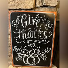 a chalkboard sign that says give's thanks