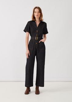 Inspired by our best-selling signature Olivia Trouser, the Olivia Jumpsuit offers a high-fashion take on a 70s aesthetic with its contrast topstitching, back patch pockets, comfortable wide leg cut, and tortoiseshell buttons, creating a chic and flattering look. Made in Australia from a 95% Cotton 5% Spandex blend. A n 70s Dark Aesthetic, Indigo Dyeing, Indigo Dyed Fabric, Contrast Topstitching, 70s Aesthetic, Garment Labels, Indigo Dye, Natural Dye, Back Patch