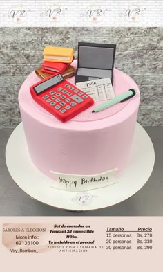 a pink birthday cake with a calculator, laptop and pen on the top