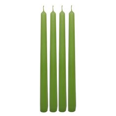 three green candles sitting next to each other