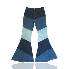 This Pair Of Pants From Peach Love California Is A Must-Have For Any Woman's Wardrobe. With A Unique Patchwork Design And Flared Leg Style, These Denim Pants Will Elevate Any Outfit. The Size Is A Comfortable L And The Color Is A Beautiful Blue That Will Complement Any Skin Tone. The Pants Are Made Of High-Quality Denim Fabric That Ensures Durability And Long-Lasting Wear. Blue Stretch Flare Jeans, High Waist Blue Stretch Flare Jeans, Retro Stretch Cotton Jeans, Trendy Blue Flare Pants, Retro Blue Jeans For Fall, Trendy Blue Flared Bottoms, Trendy Blue Flare Bottoms, Retro Stretch Blue Flare Jeans, Retro Blue Cotton Flare Jeans