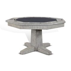 a concrete table with black top and four legs