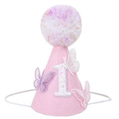 a pink birthday hat with a number one on it and butterflies around the top that says 1