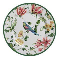 a white plate with flowers and birds on the front, in green trimmings