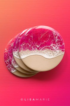 three coasters with pink and white designs on them against a bright pink background that reads, lismaarie