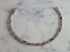 "A WOMENS VINTAGE ESTATE STERLING SILVER GARNET & CZ BRACELET.  BRACELET  MEASURES 7 3/8\" LONG  BY 3/16\" WIDE AND WEIGHS 6.5g.  THIS WOULD MAKE A LOVELY GIFT FOR THAT SOMEONE SPECIAL.  ANY QUESTIONS, PLEASE DON'T HESITATE TO ASK.  BE SURE TO CHECK OUT SOME OF MY OTHER GREAT ITEMS UP FOR SALE. THANK YOU. IF THERE ARE ANY ISSUES PLEASE CONTACT US, WE'RE ALWAYS HAPPY TO TRY TO HELP YOU OUT AS BEST AS WE CAN." Gold Heart Bracelet, Cz Bracelet, White Gold Bracelet, Bracelet Vintage, Yellow Gold Bracelet, Multi Stone, Heart Bracelet, Stone Bracelet, Arm Band