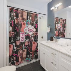 a bathroom with two sinks and a large shower curtain in the middle of the room