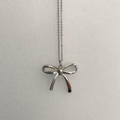 Cute And Trendy Bow Necklace! Never Worn In Very Good Condition. Silver Elegant Necklace, Girly Jewelry Silver, Silver Bow Necklace For Wedding, Elegant Sterling Silver Necklace With Bow, Silver Bow Dangle Jewelry, Silver Bow Necklace, Elegant Bow Pendant Necklace, Dainty Silver Necklace, Trendy Silver Jewelry