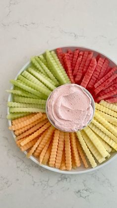 a platter filled with crackers and dip