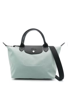 The Longchamp Le Pliage Energy Tote Bag features a foldover top with a press-stud fastening. It has a top zip fastening, two rolled top handles, an adjustable and detachable shoulder strap, and a branded zip puller. The bag has an embossed logo to the front, a mini logo tag, a main compartment, an internal patch pocket, and is unlined. It features a top handle and a shoulder strap. Longchamp Le Pliage Energy, Longchamp Small Le Pliage, Mini Logo, Zip Puller, Mini Logos, Logo Tag, Press Studs, Longchamp Le Pliage, Green Bag