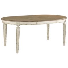 an oval wooden table with white legs