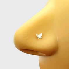 a close up of a plastic breast with a butterfly on it's back end