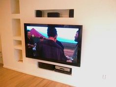 a flat screen tv mounted on the wall