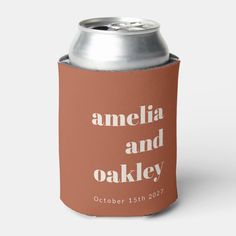 an orange can cooler with the words amelia and oakey printed on it