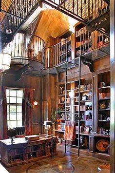 an old library with bookshelves and stairs