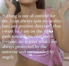 a woman in a pink bra top with her hand up to her face and the words, nothing is out of control for me i can always spin my reality