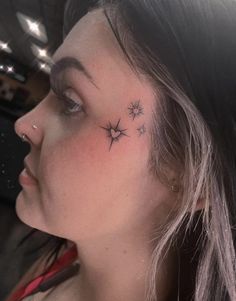 a woman with a star tattoo on her neck