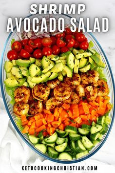 shrimp and avocado salad with tomatoes, cucumbers, lettuce, carrots and cherry tomatoes